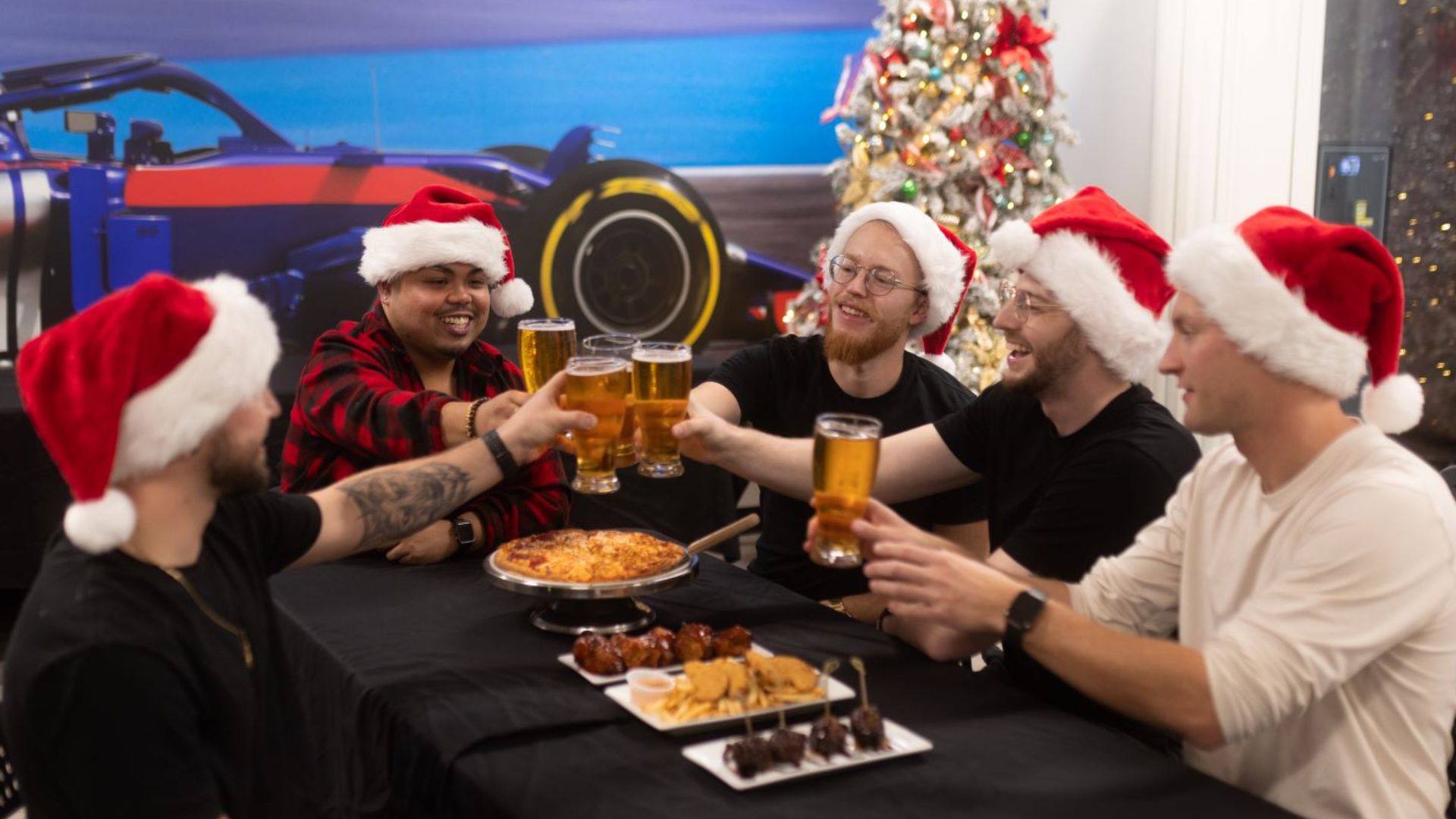 People in santa hats in party room at k1 speed ontario