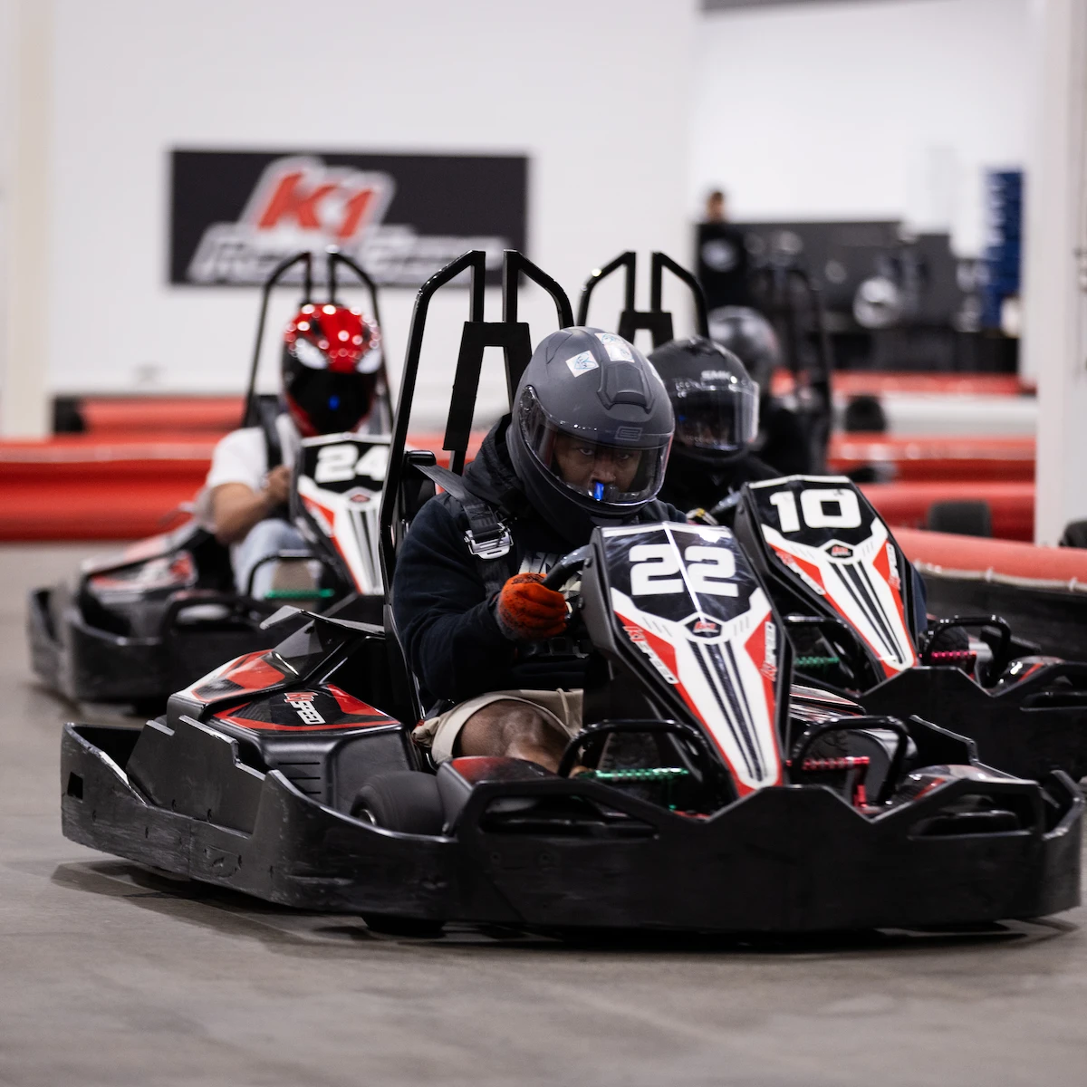 best go karting party options by city Kids racing go-karts at an indoor karting party venue in Ontario