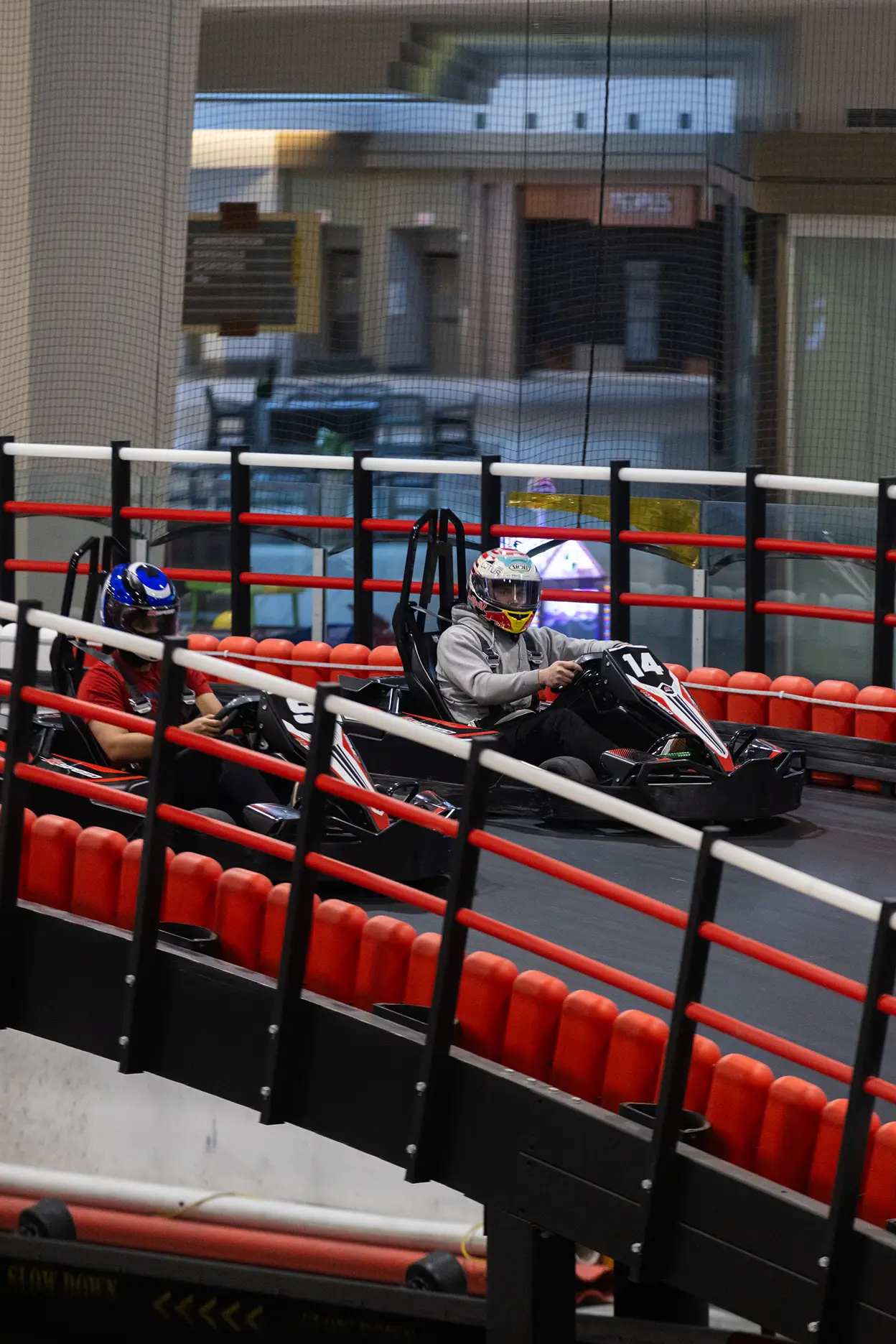 best go-karting venues for kids birthday parties Kids racing electric go-karts at an indoor birthday party venue